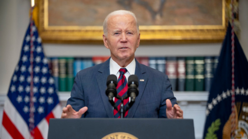 Joe Biden speaking behind a podium.